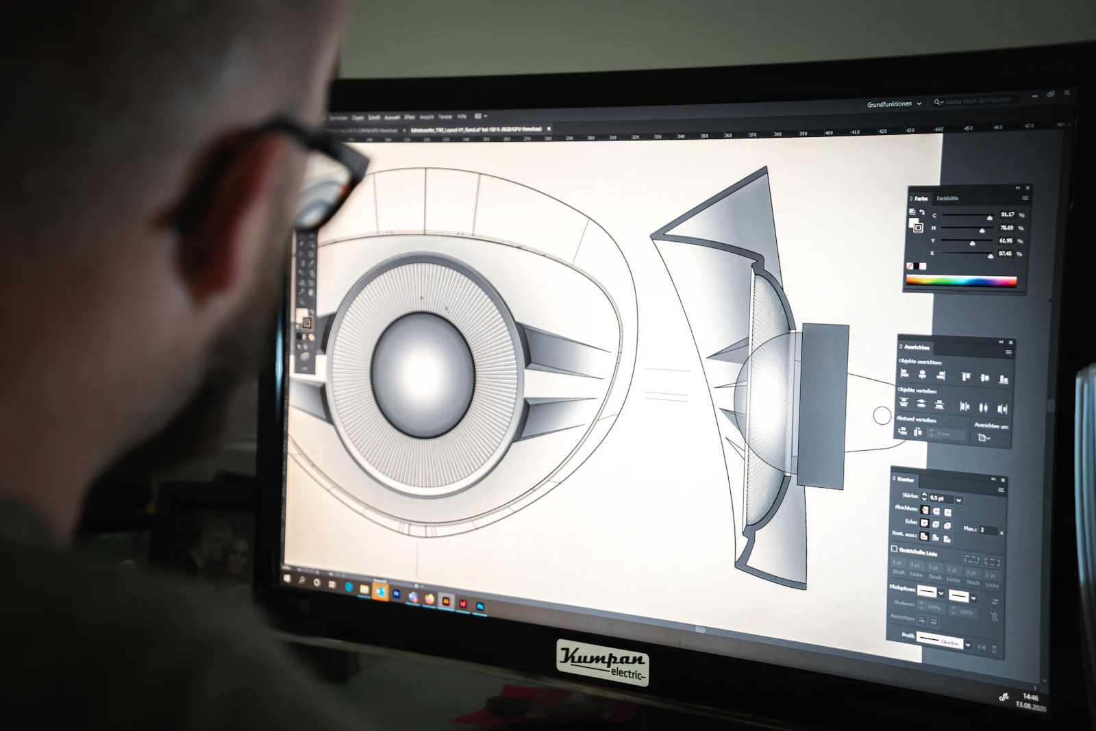 Engineer working on a 3D CAD model on a computer monitor